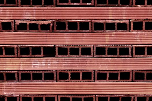 background or texture perforated red terracotta bricks