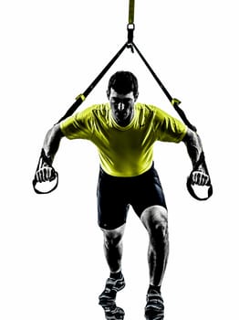 one  man exercising suspension training trx on white background