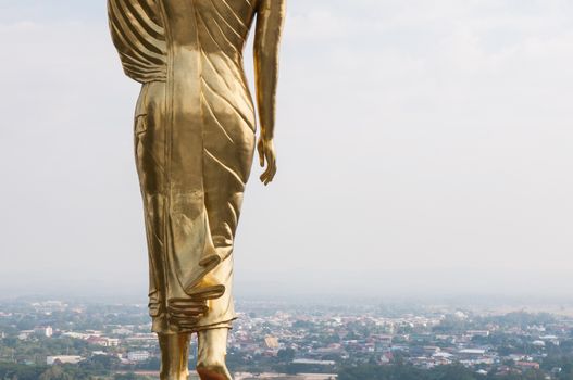 Buddha standing on a mountain Wat Phra That Khao Noi, Nan Province, of Thailand