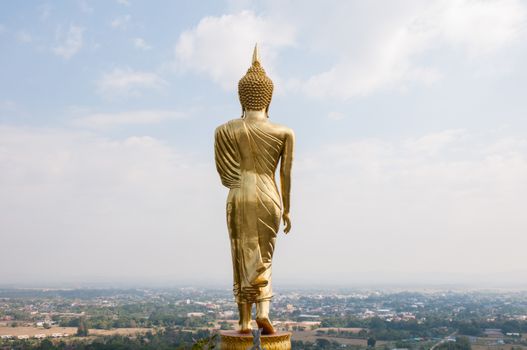 Buddha standing on a mountain Wat Phra That Khao Noi, Nan Province, of Thailand