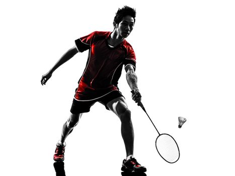 one asian badminton player young man in silhouette isolated white background