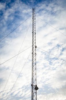 Telecommunication pylon against a sky background