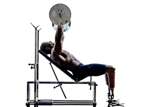one muscular handicapped man body builders building weights with legs prosthesis in silhouettes on white background