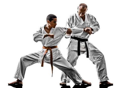 two karate men sensei and  teenager students teacher teaching isolated on white background