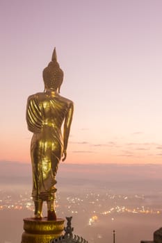 Buddha standing on a mountain Wat Phra That Khao Noi, Nan Province, Thailand