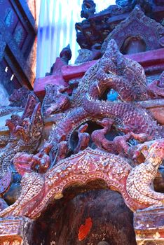 ancient complicated stucco work showing of traditional thai pattern that decorated with mirror and precious stone,Lampang temple,Thailand