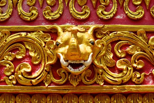 high complicated stucco work showing of traditional thai pattern that decorated with mirror and precious stone,Lampang temple,Thailand