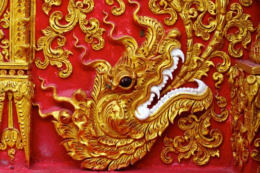 high complicated stucco work showing of traditional thai pattern that decorated with mirror and precious stone,Lampang temple,Thailand