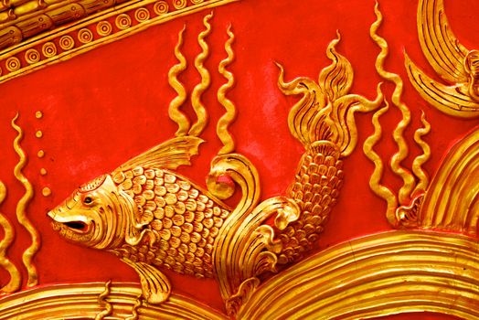 stucco work showing of traditional thai monster pattern that decorated with mirror and precious stone,Lampang temple,Thailand