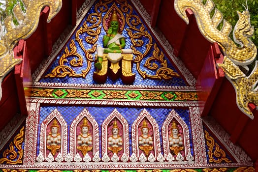 ancient stucco work that decorated with mirror and precious stone ,Lampang temple,Thailand