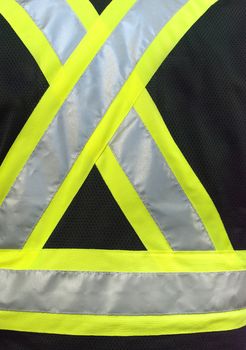 Close-up of a construction safety vest, from the back.