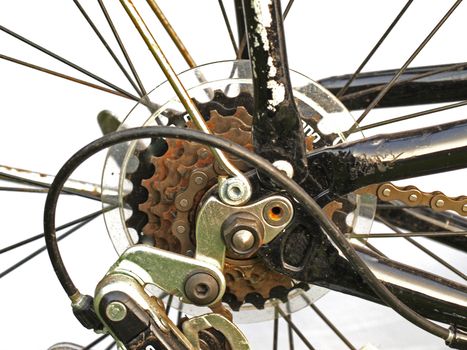 Close up of rusty bicycle gears and chain.
