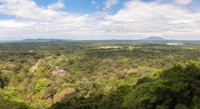 Landscape of Sri lanka with Sigiriya Gardens and buddha statue.