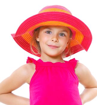 Cute little girl wearing a beach hat smiling isolated on a white background.