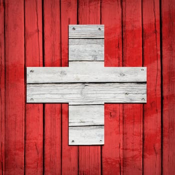 Swiss flag painted on wooden boards. Grunge style