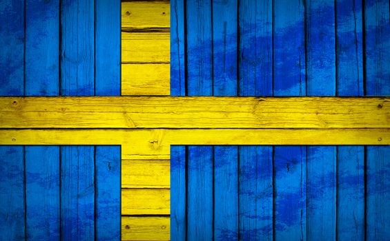 Sweden flag painted on wooden boards. Grunge style