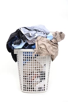 unwashed cloth in the basket on white background