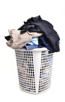 unwashed cloth in the basket on white background