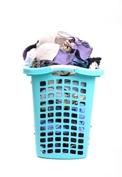 unwashed cloth in the basket on white background