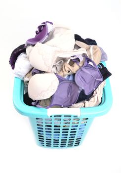 unwashed cloth in the basket on white background