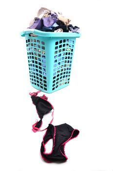 unwashed cloth in the basket on white background