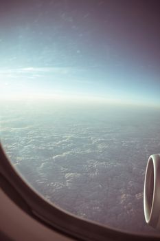 View through the aircraft window. Stratosphere cloudscape.