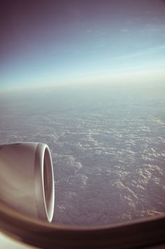 View through the aircraft window. Stratosphere cloudscape.