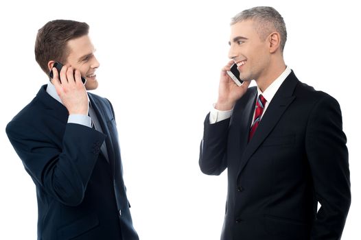 Handsome businessmen communicating through cellphone