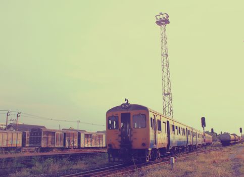 Old train on railway with retro filter effect