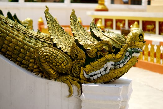 stucco work in thai art that usually decorated with mirror and precious stone or gold leaf,Chiang rai temple,Thailand