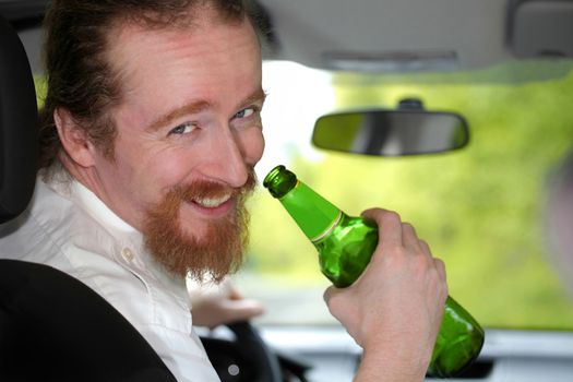 Drunk man in car with a bottle beer