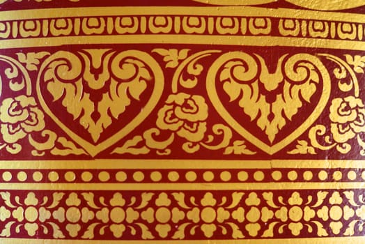 various of thai patterns on temple wall and pillars that  usually present in red,black and gold colour