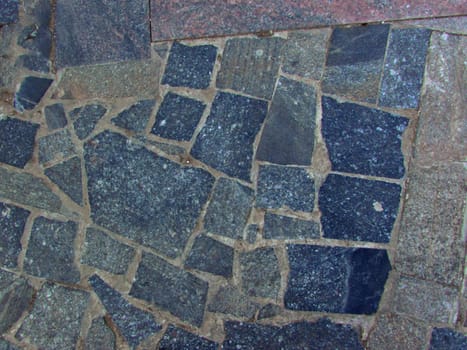Texture in the form of old gray slabs of the road