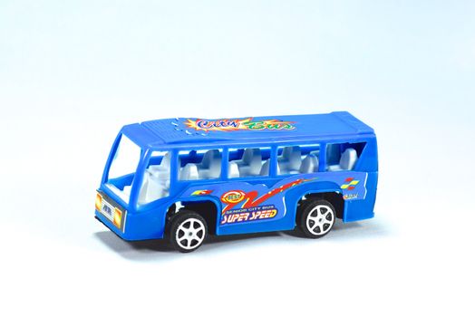 model of blue minibus on white scene,shallow focus