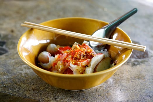 "yen tah fo "one of favourite traditional thai noodle that mixed sea foods with noodle in red soup,shallow focus
