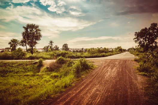 Soil road and grass meadow in  countryside view nature