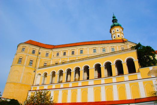 Mikulov castle with typical arcade, tower and yellow facade (Czech Republic)