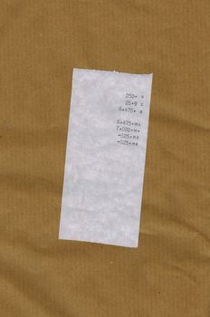 bill or receipt isolated over brown paper background