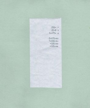 bill or receipt isolated over light green paper background