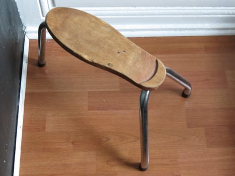 shoe stool made of wood with steel legs