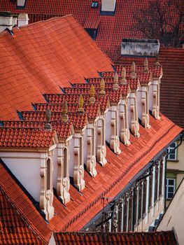 Old red roof with dormer-windows in a row (Prague, Czech Republic)