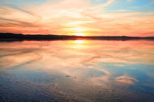 Magnificent sunset and water reflections at Long Jetty, NSW Australia