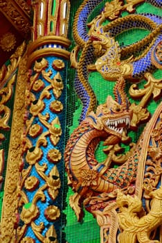 ancient stucco work that decorated with mirror and precious stone ,Lampang temple,Thailand