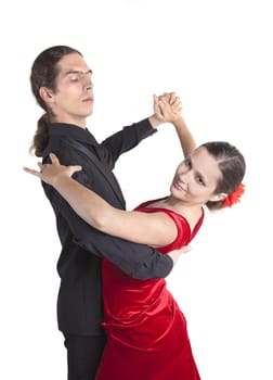 Young couple dancing waltz isolated over white background