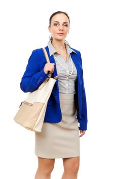 An image of a business woman with a beige handbag