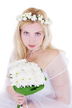 Sensual blonde bride in wreath and bouquet isolated on white