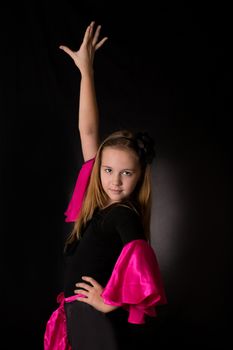 Flamenco little dancer posing isolated on black