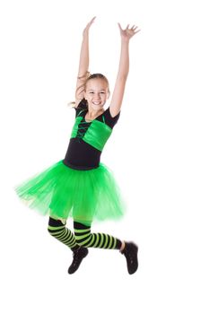 Happy girl in tutu skirt jumping isolated on white, in motion