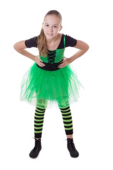 Smiling dancer in green tutu skirt standing isolated on white