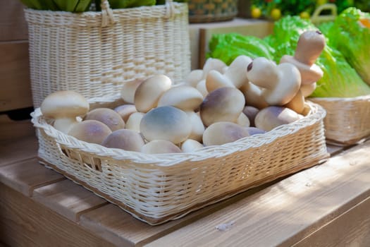 Fresh mushrooms on a wooden basket